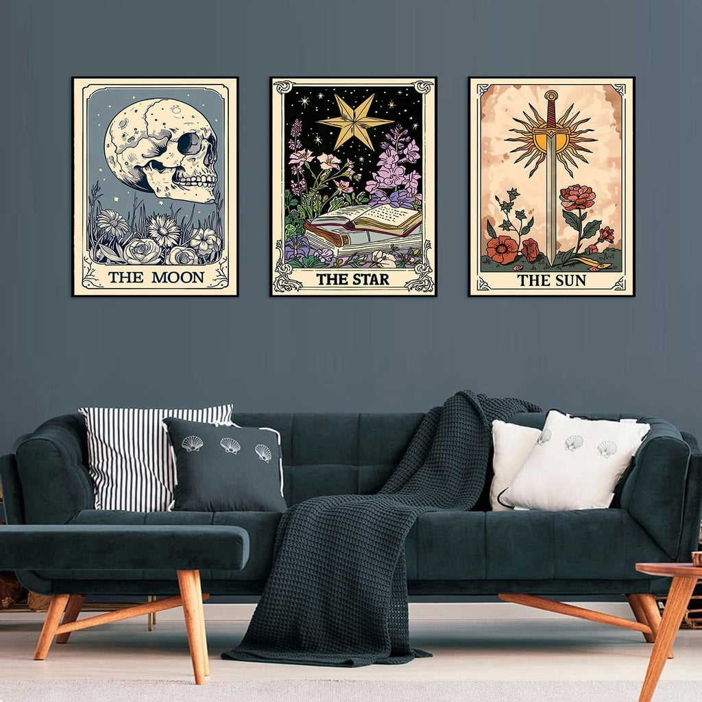 Three framed tarot card art prints depicting The Moon, The Star, and The Sun displayed on a wall above a sofa.