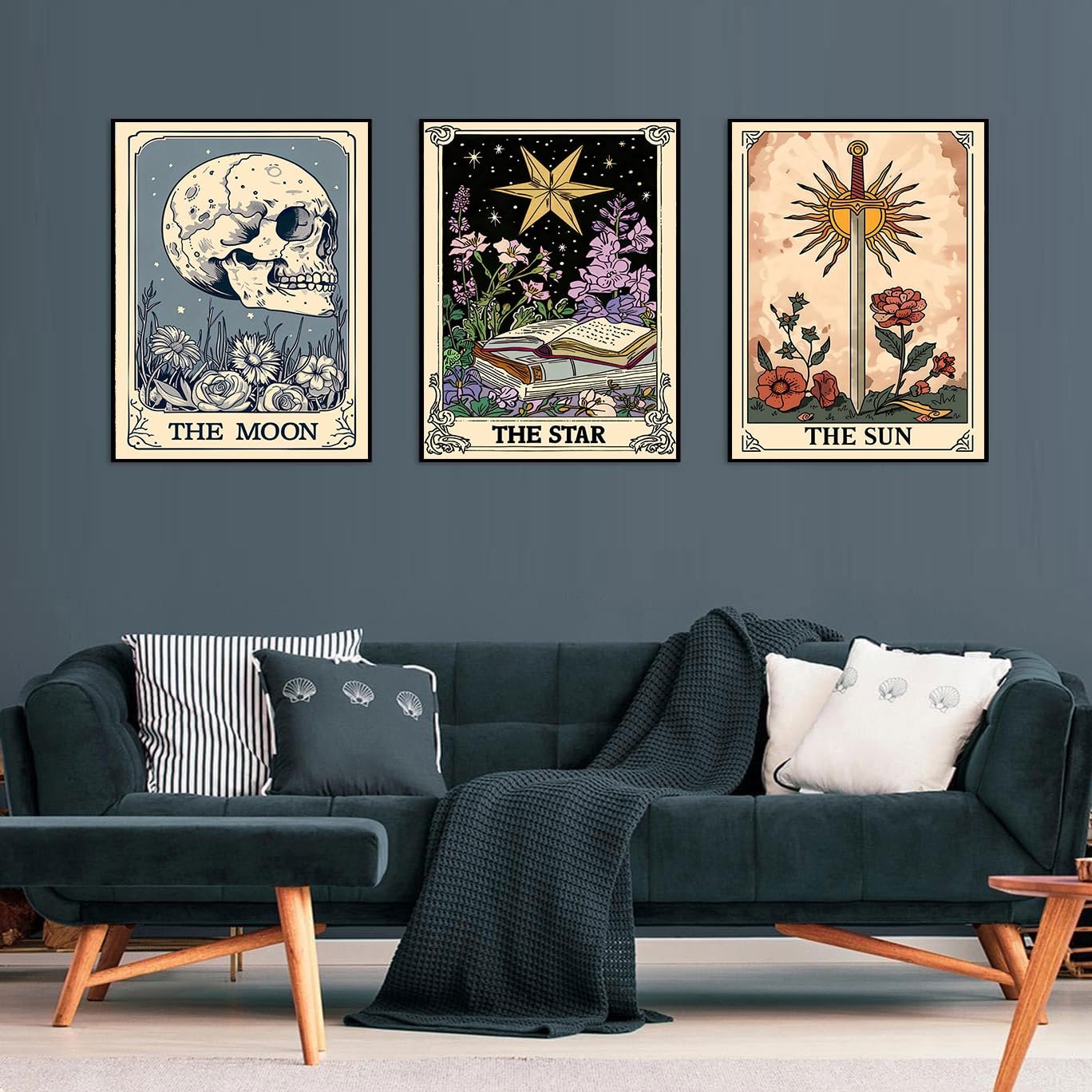 Three framed tarot card art prints depicting The Moon, The Star, and The Sun displayed on a wall above a sofa.