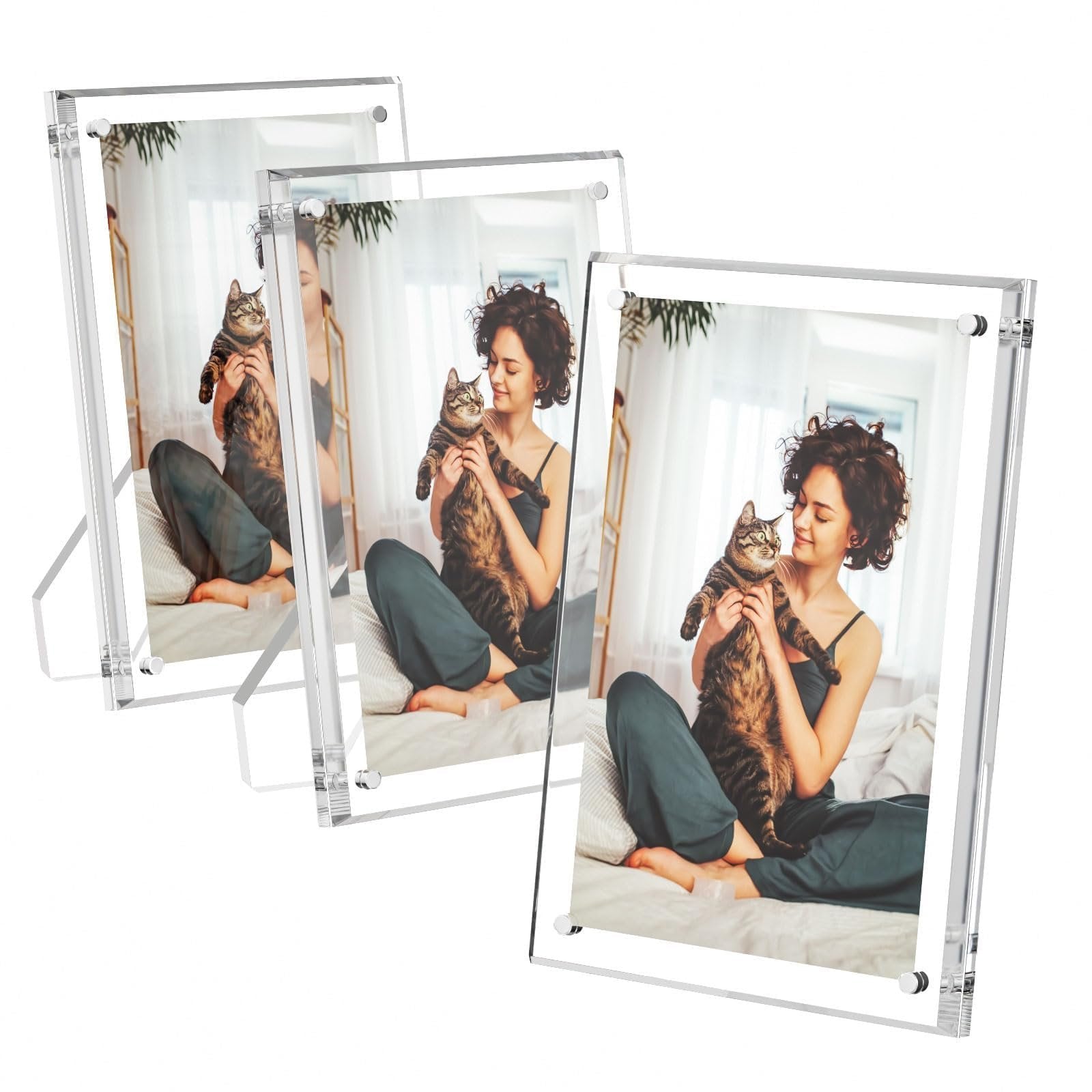 Three clear acrylic picture frames displaying a woman holding a cat, shown from a front-right angle on a white background.