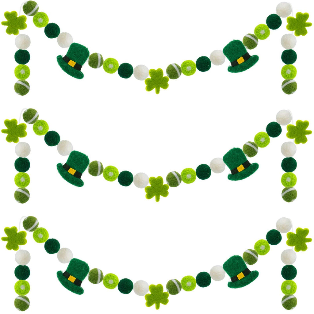Three green and white felt pom pom garlands with shamrocks and leprechaun hats for St. Patrick's Day