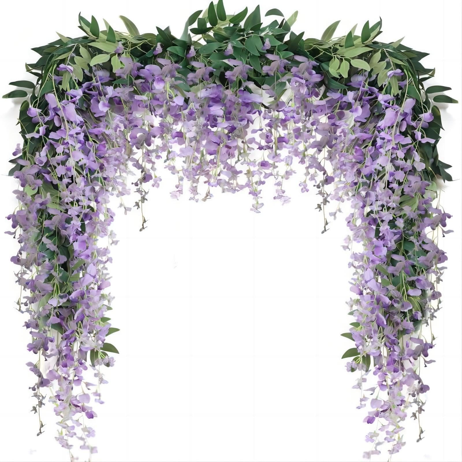 Artificial purple wisteria vine garland with green leaves draped over a white background