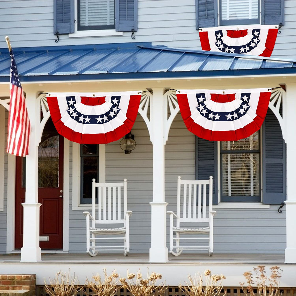 Two pleated fan flags with red, white, and blue stripes and white stars are hung on a porch, with a US flag on the left.