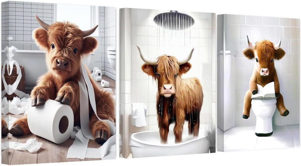 Three framed art panels depicting Highland cows in bathroom scenes: one with toilet paper, one in a shower, and one reading on a toilet.
