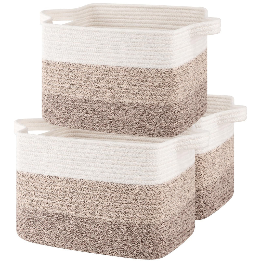 Three gradient yellow woven storage baskets with white handles stacked together on a white background.