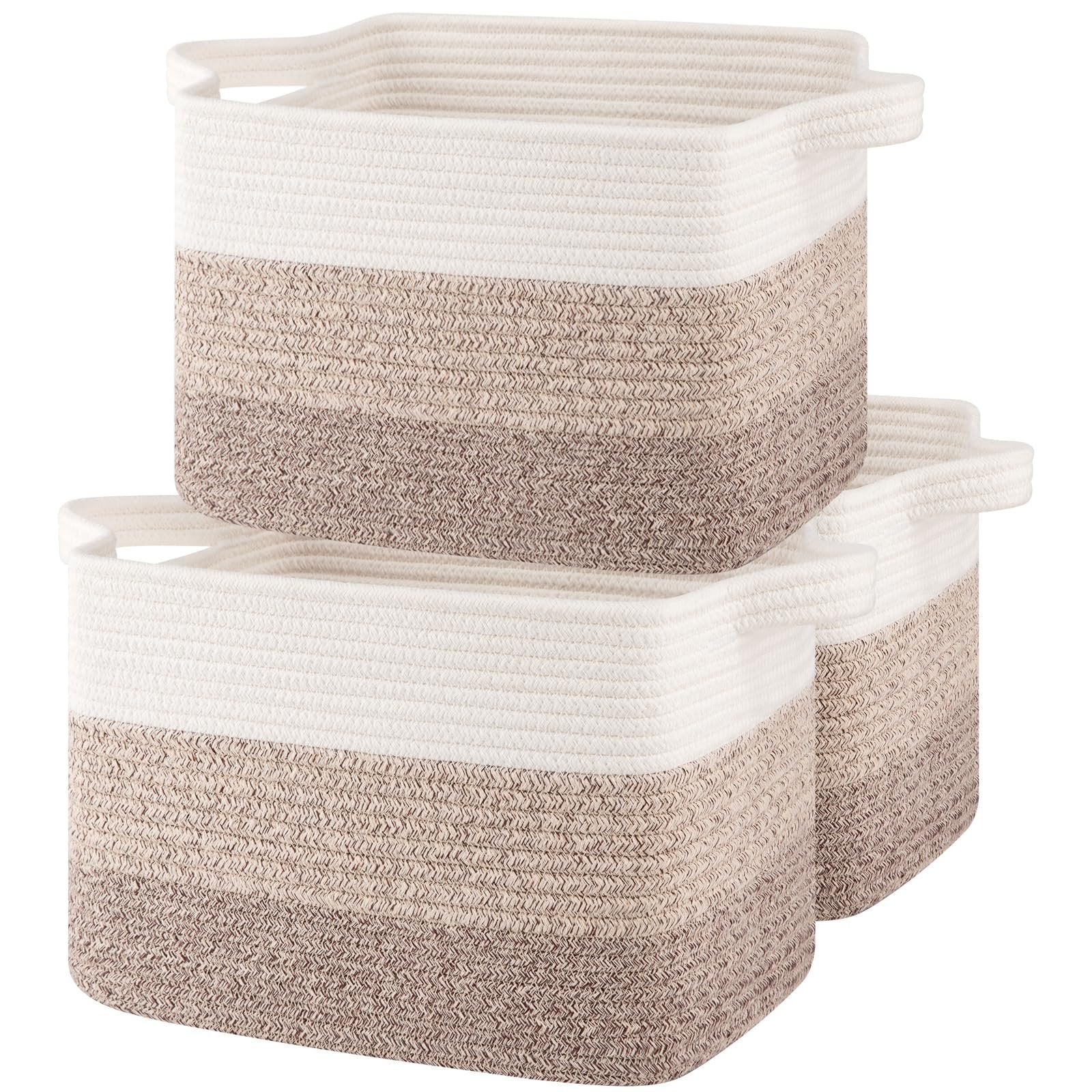 Three gradient yellow woven storage baskets with white handles stacked together on a white background.