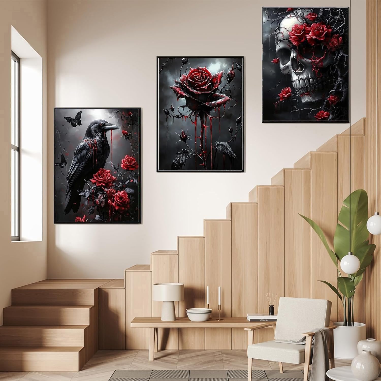 Three framed Halloween diamond art paintings depicting a raven with roses, a dripping rose, and a skull with roses, displayed in a modern home setting.