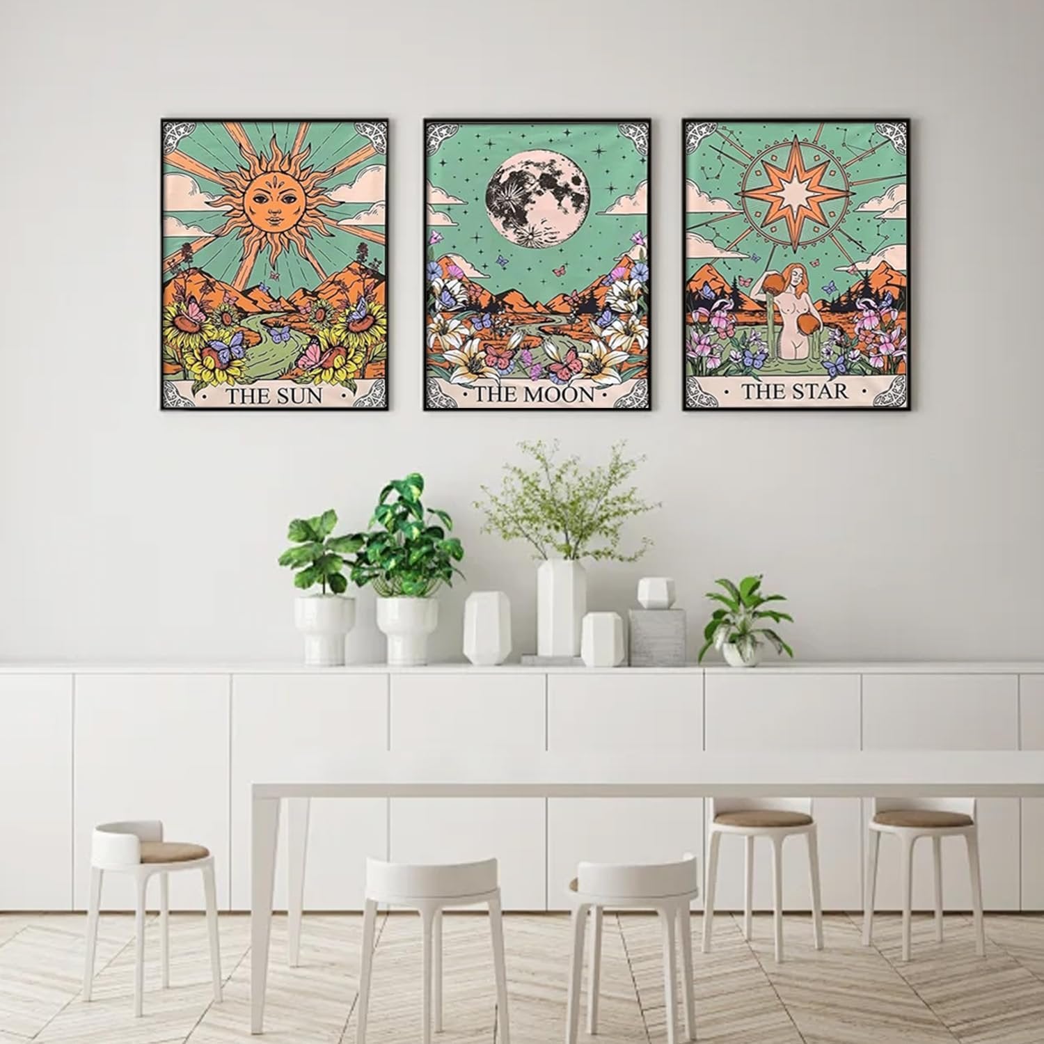 Three framed tarot-themed diamond art prints depicting the Sun, Moon, and Star, displayed on a wall above a white credenza.