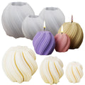 Set of silicone molds and finished candles in various sizes and colors, including white, purple, pink, and beige.