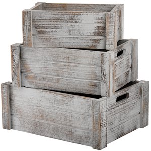 Three stacked rustic white wooden crates with handles, varying sizes, isolated on white background.