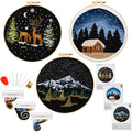 Three embroidered hoops with winter scenes, plus embroidery tools and thread organizers.