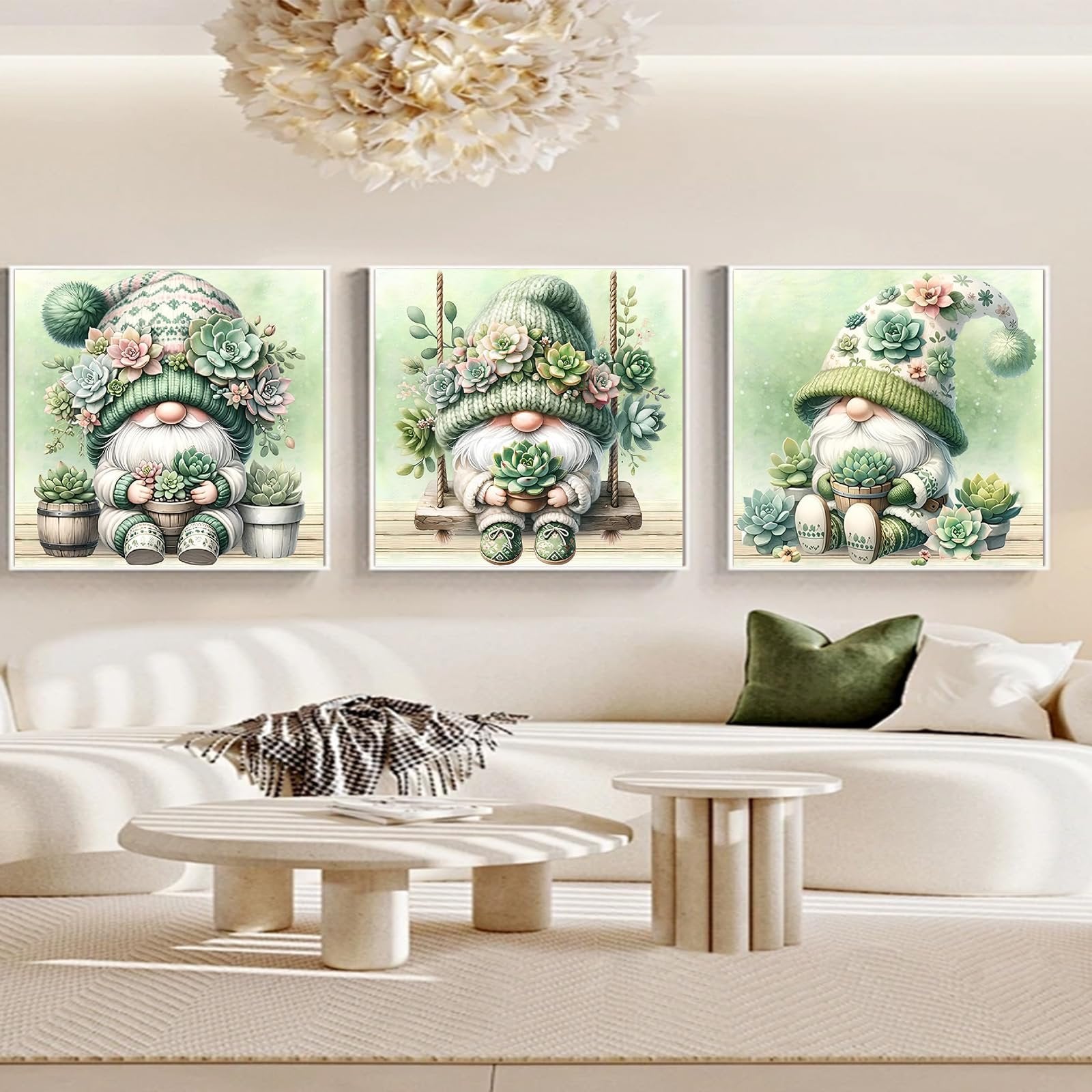 Three framed 5D diamond art paintings of gnomes decorated with succulents, displayed on a wall above a sofa.