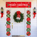 Christmas porch banner and hanging ornaments displayed on a white door with a wreath