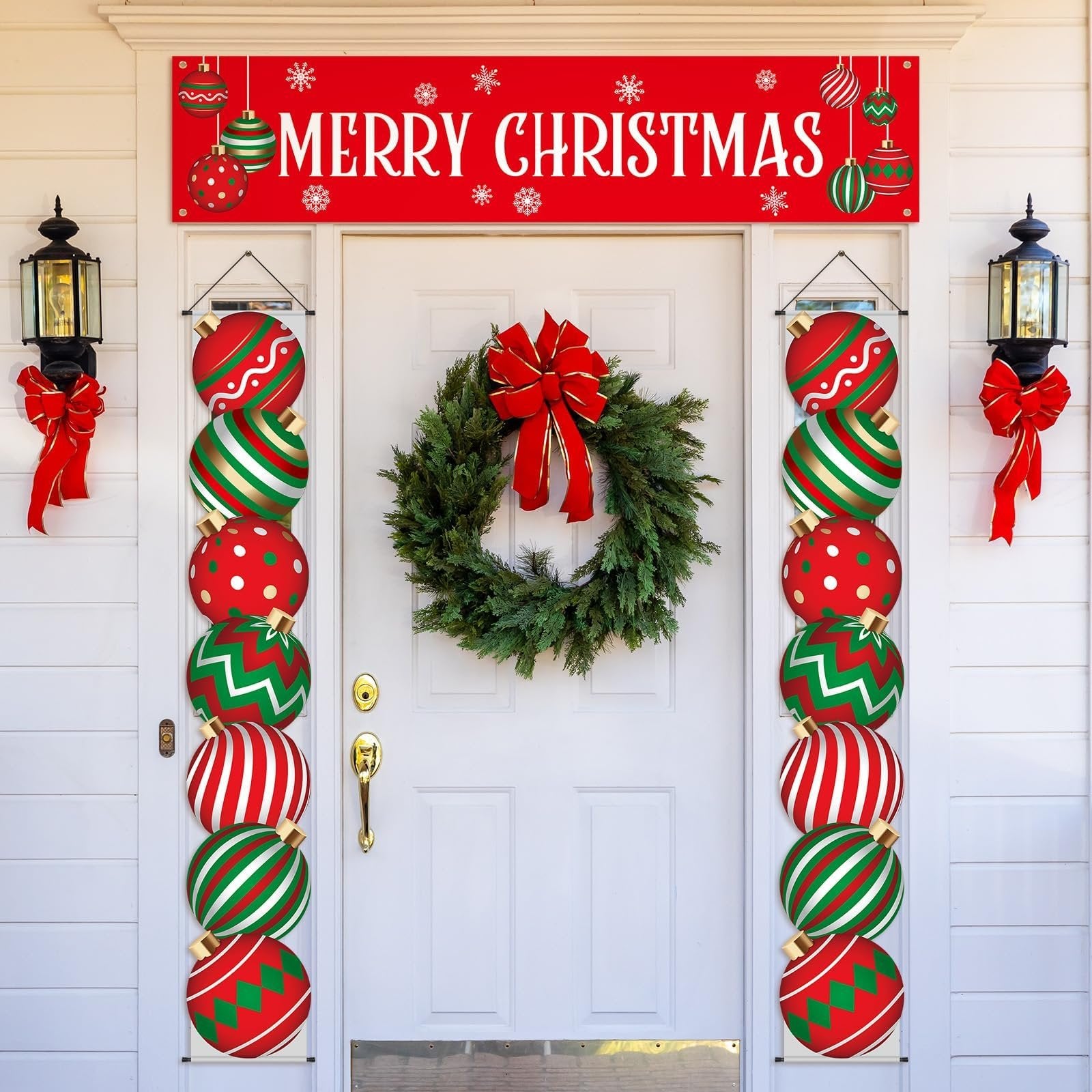 Christmas porch banner and hanging ornaments displayed on a white door with a wreath