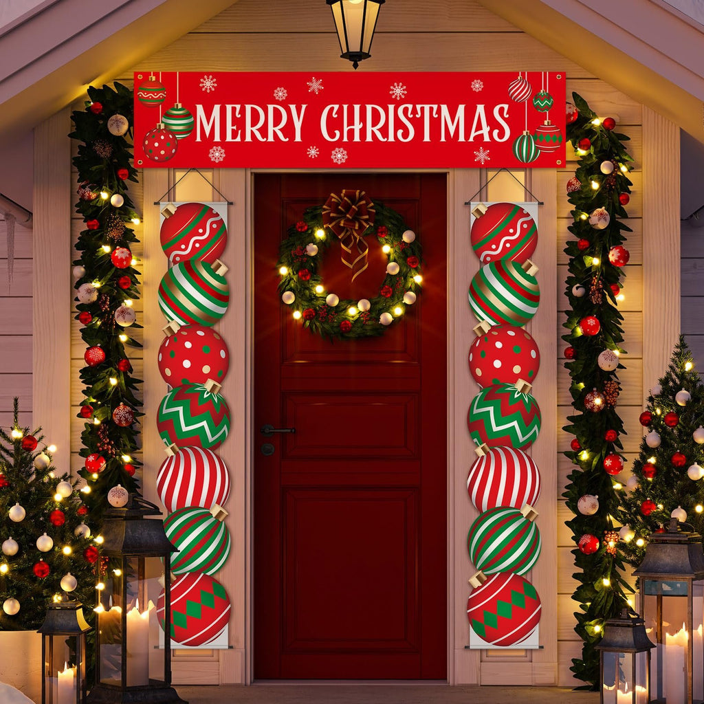 Christmas porch banners and garland decorating a front door with a wreath and Christmas trees