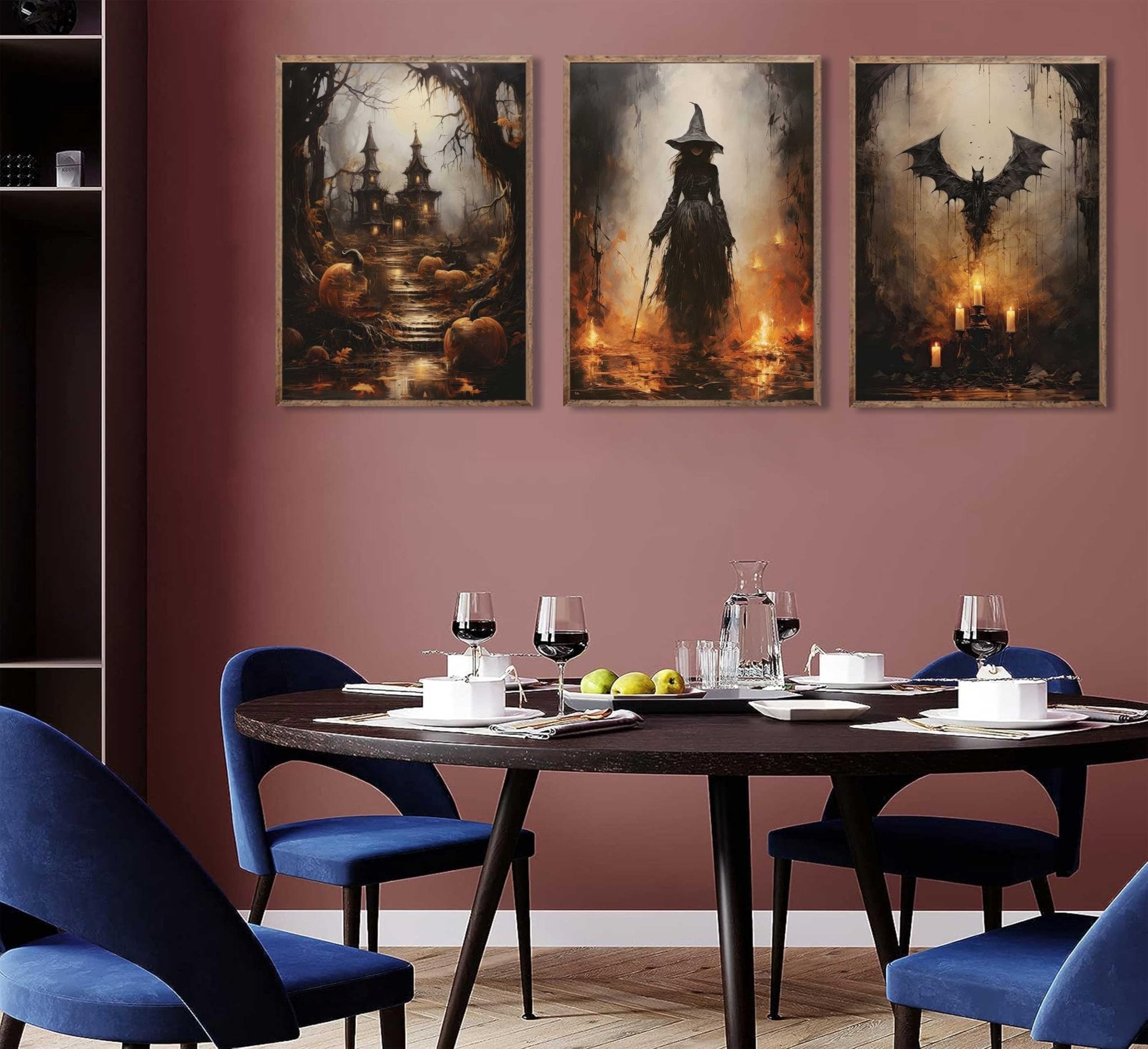 Three Halloween-themed canvas prints depicting a spooky castle, a witch, and a bat, displayed above a dining table setting.