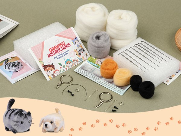 Needle felting starter kit contents including wool, needles, foam pads, keychains, and instruction booklet with finished cat and dog figures.