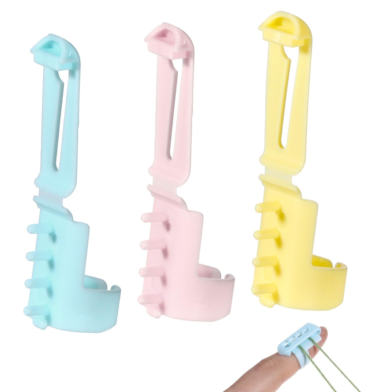 Three plastic yarn guide rings in pink, blue, and yellow, with one on a finger showing yarn passing through.