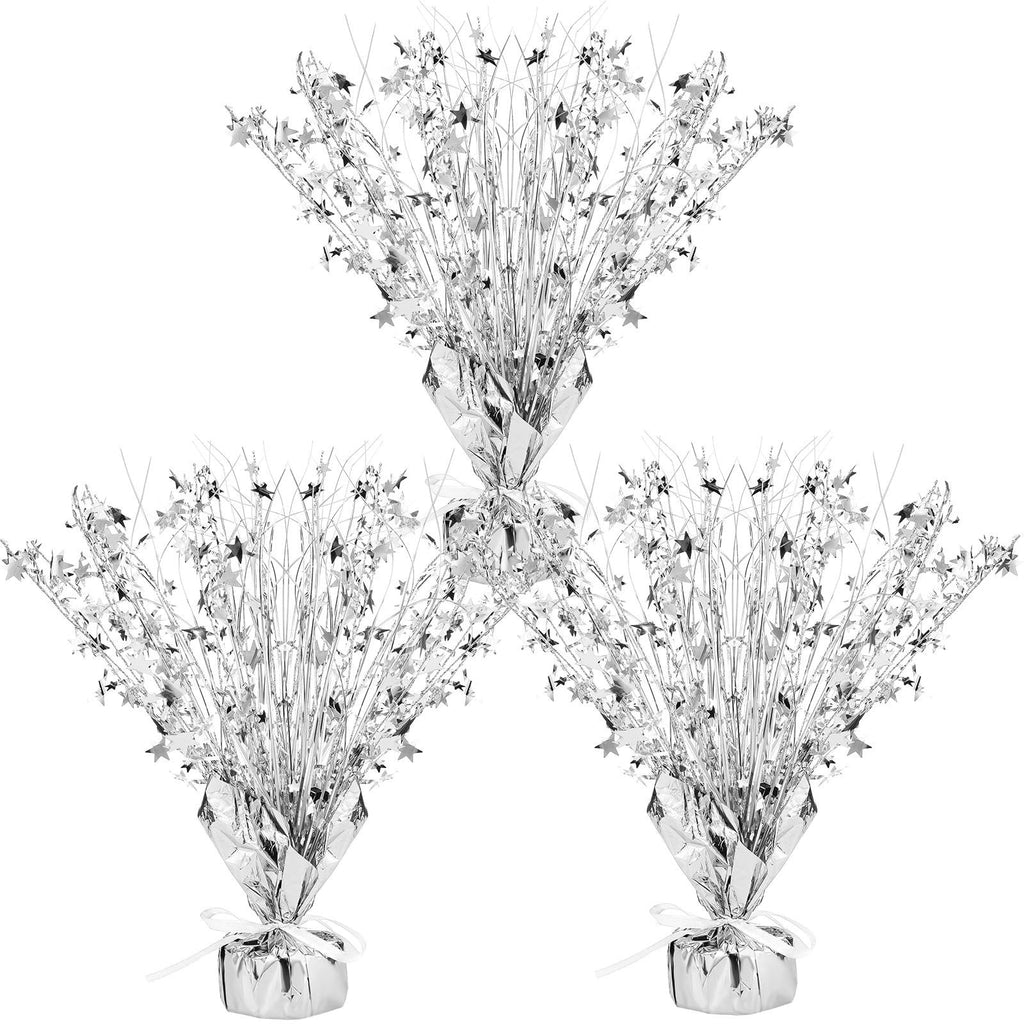 Three silver metallic foil spray star burst table centerpieces arranged in a triangular formation on a white background.