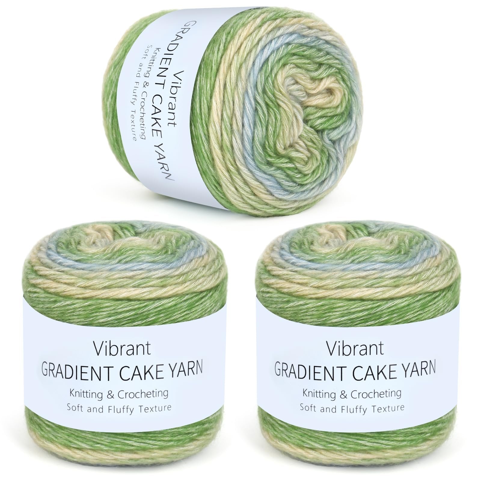 Three skeins of gradient cake yarn in green, cream, and blue hues, displayed against a white background.