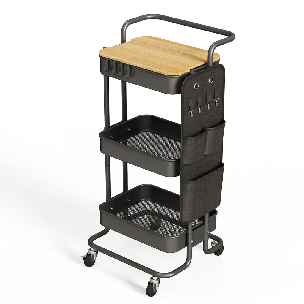 Three-tier black metal rolling cart with a wooden top shelf, side storage bags, and hooks, shown from a three-quarter front angle on a white background.