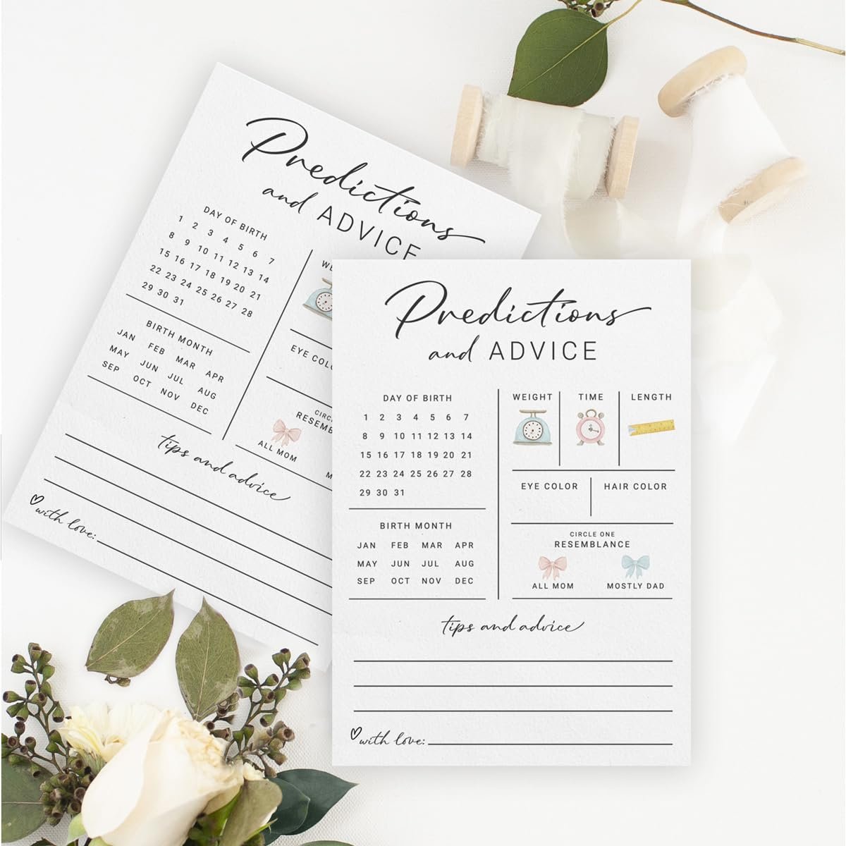 Two baby shower prediction and advice cards with fields for day of birth, birth month, weight, time, length, eye color, hair color, and resemblance.