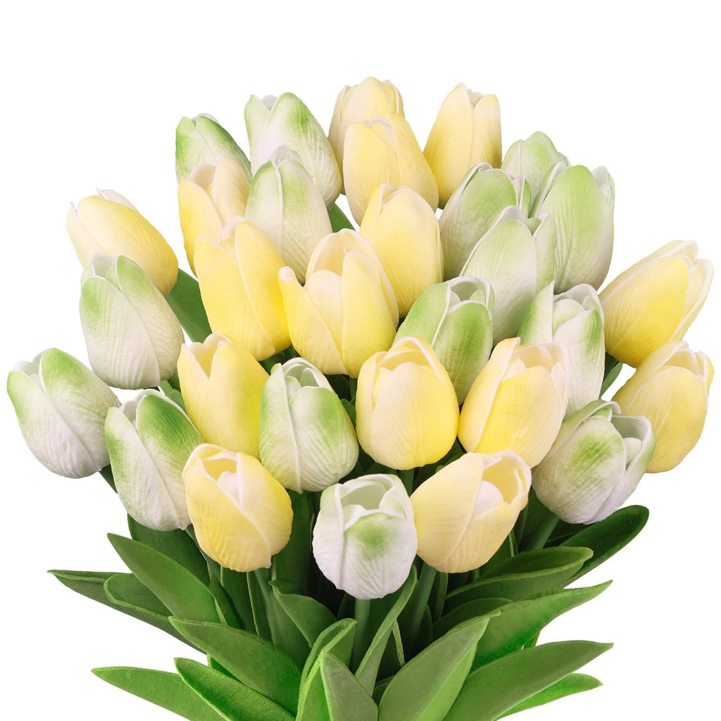 Bouquet of artificial yellow and green tulips with green leaves, isolated on white background.