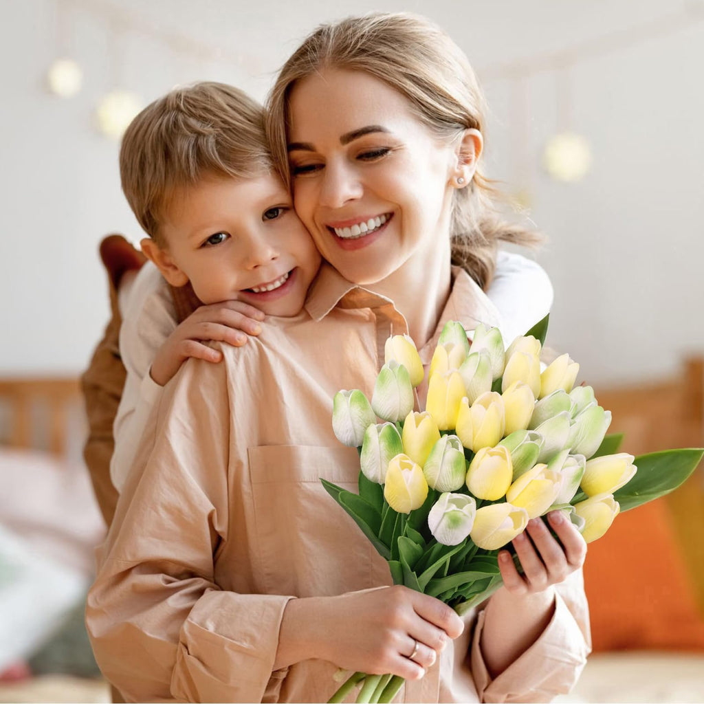 Mother and son embracing, holding a bouquet of yellow and green artificial tulips