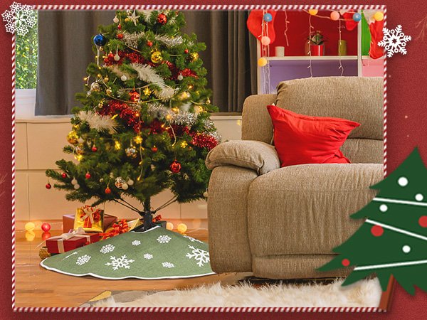 Green burlap Christmas tree skirt with white snowflake print around a decorated tree