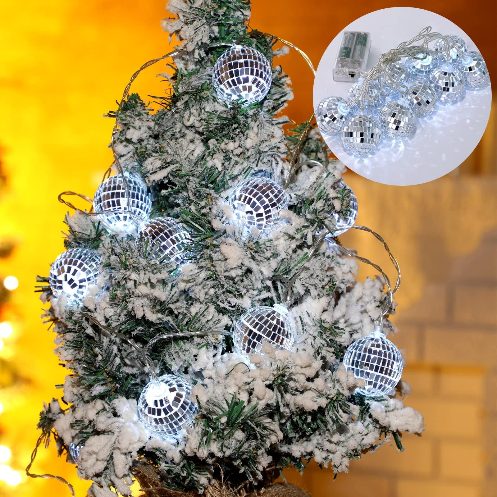 Disco ball string lights with white LEDs on a flocked Christmas tree, inset shows battery pack and lights