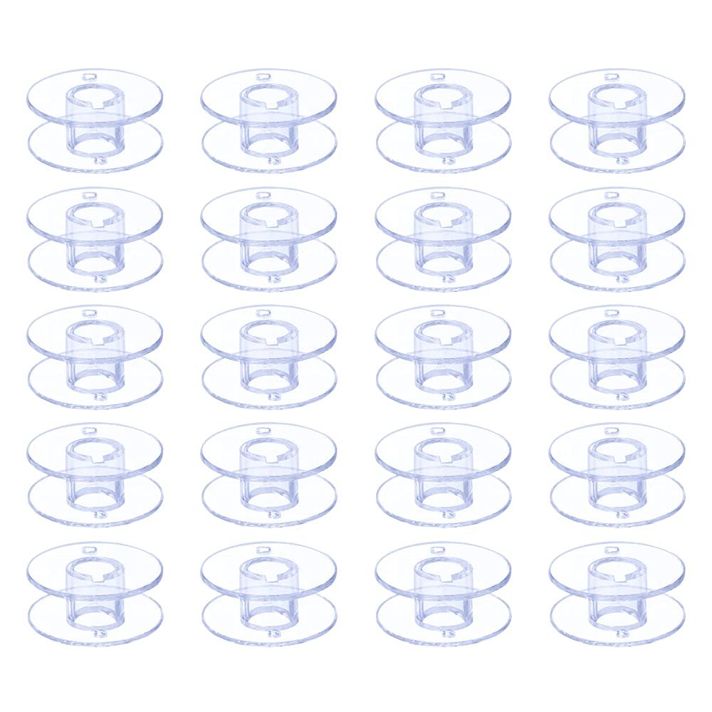 Thirty transparent plastic sewing machine bobbins arranged in a grid on a white background.