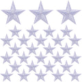 White embroidered star patches arranged in rows on a white background.