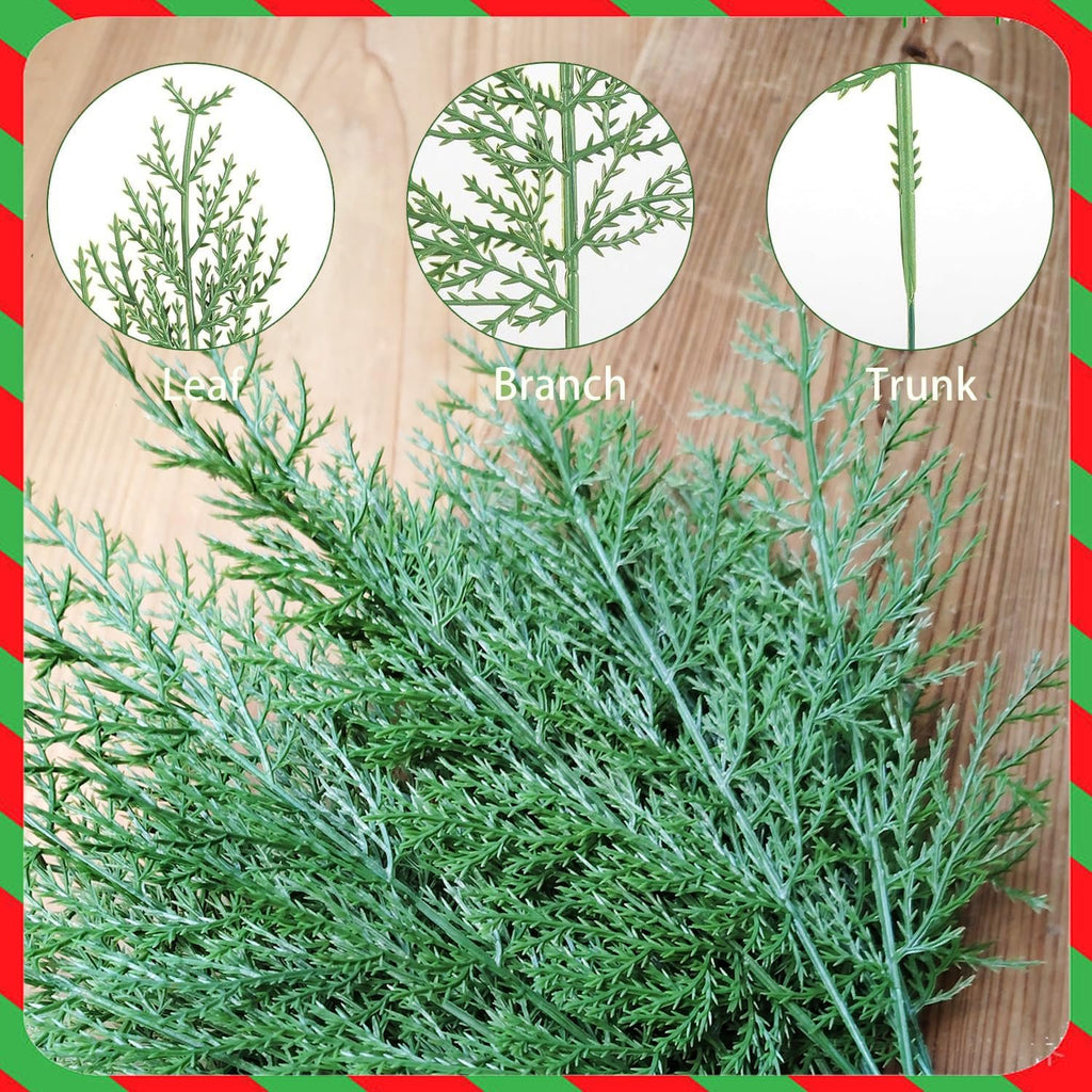 Close-up of artificial cypress pine branches showing leaf, branch, and trunk details on a wooden background with a festive red and green border.