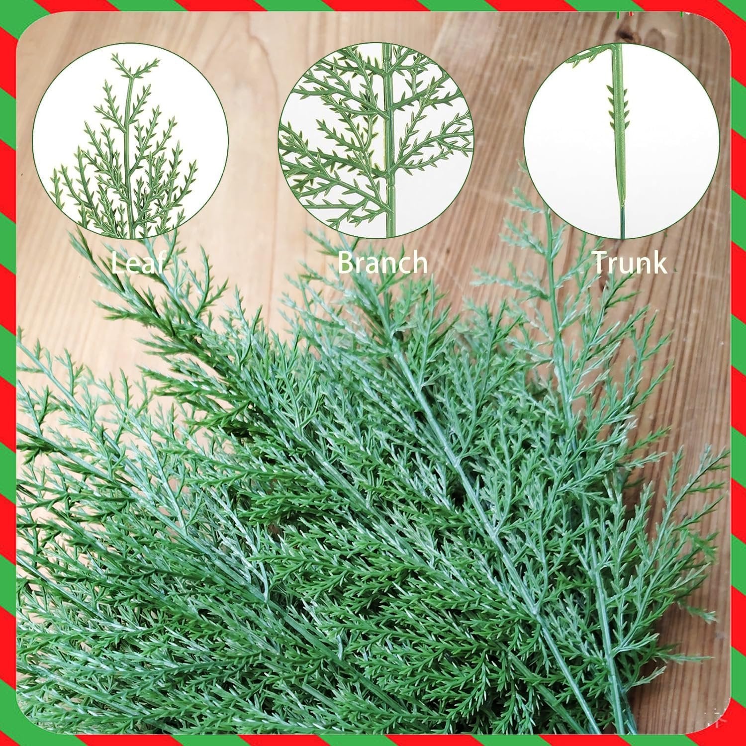 Close-up of artificial cypress pine branches showing leaf, branch, and trunk details on a wooden background with a festive red and green border.
