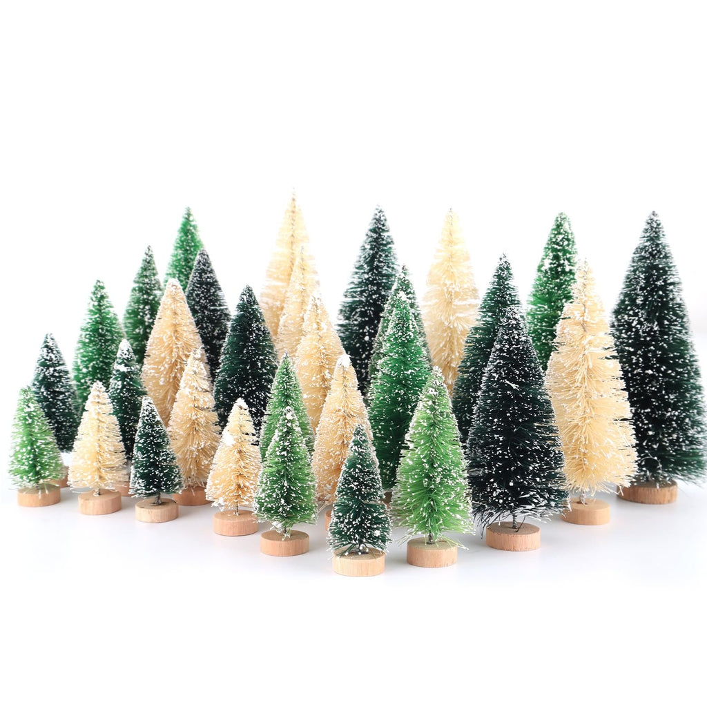 Assortment of mini snowy bottle brush Christmas trees with wooden bases on a white background.