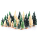 Assortment of mini snowy bottle brush Christmas trees with wooden bases on a white background.