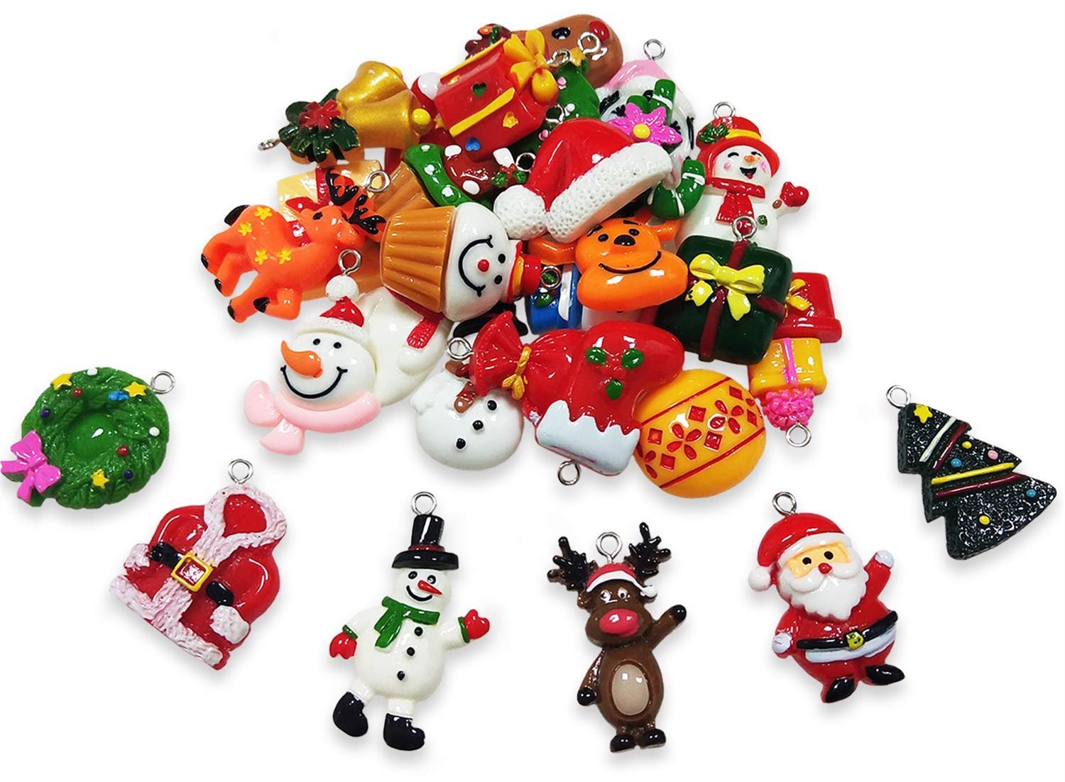 Assorted mini Christmas resin charms including Santa, snowmen, reindeer, wreaths, and trees on a white background.