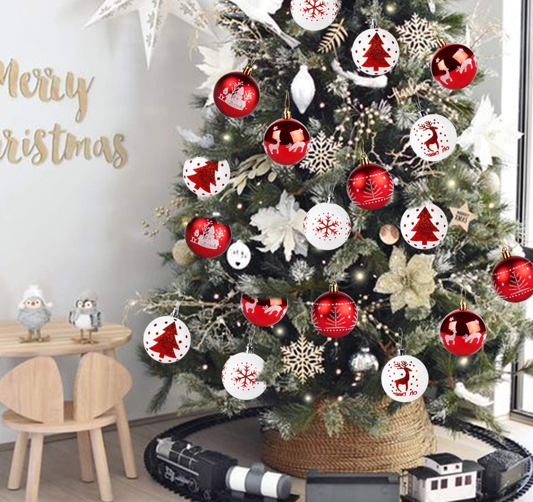 Red and white shatterproof Christmas ball ornaments with festive patterns hanging on a decorated tree.