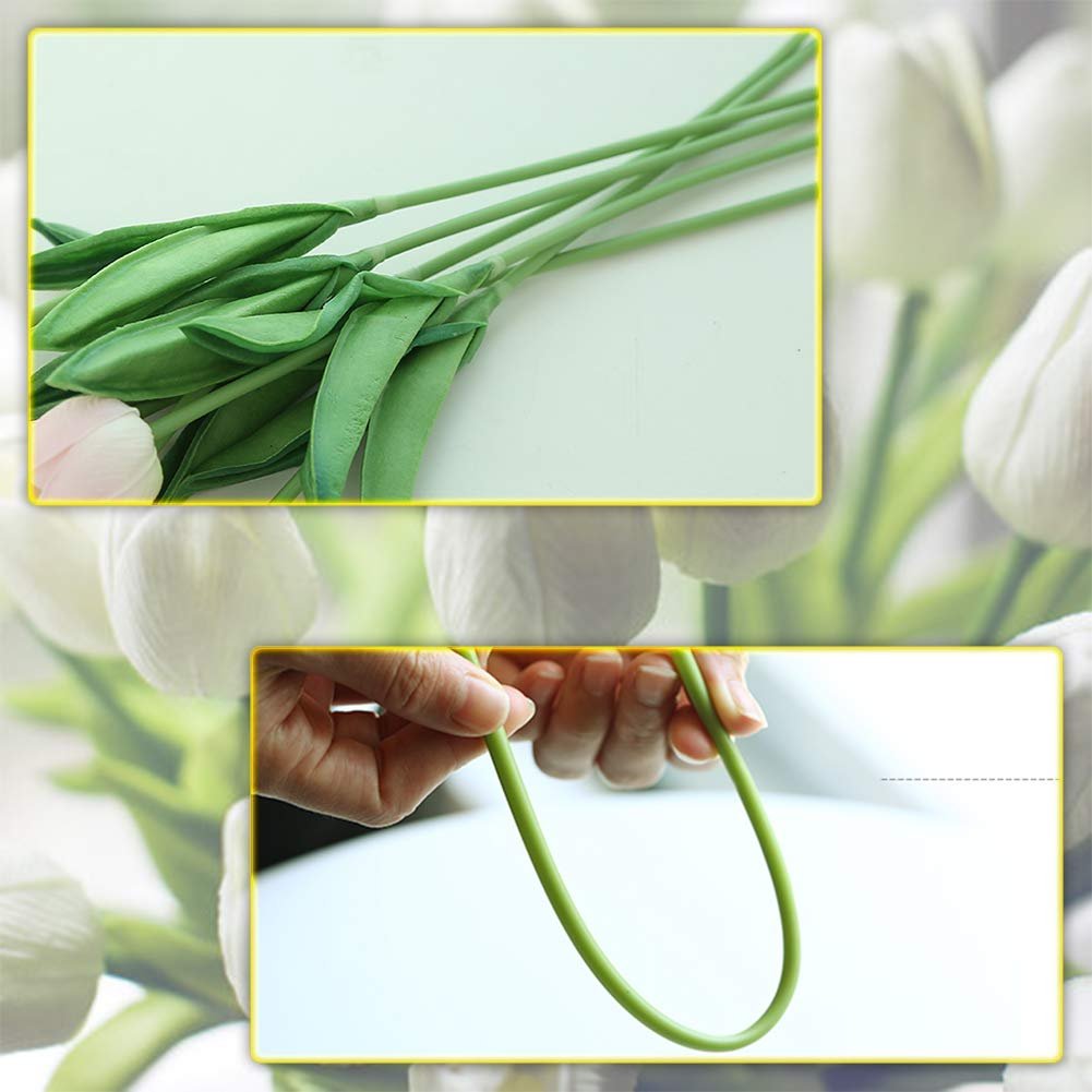 Close-up of artificial tulip stems and leaves, with a hand bending a green wire stem.