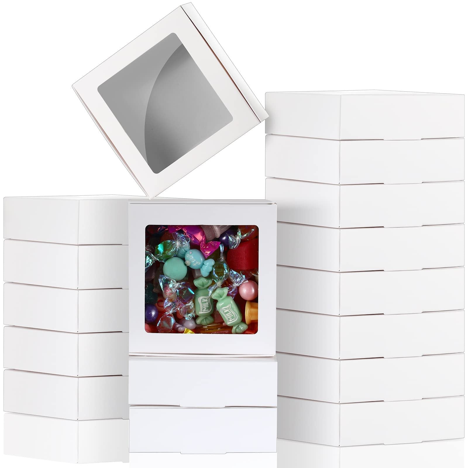 Stack of white paper boxes with clear windows, one box filled with colorful candies