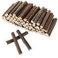Pile of natural birch wood log sticks for crafts, with two sticks crossed in the foreground.