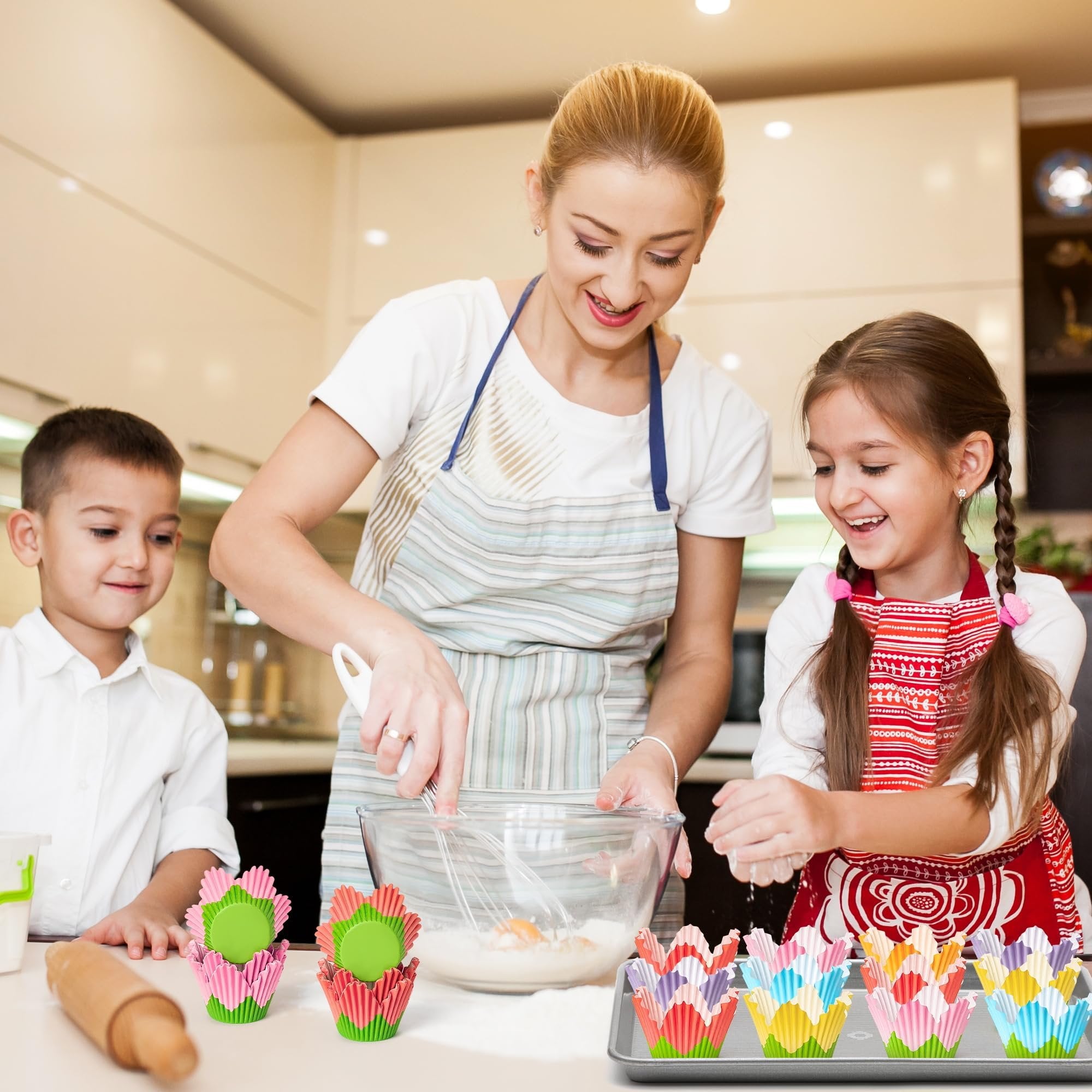 Mother and two children baking together, with colorful flower cupcake liners in the foreground.