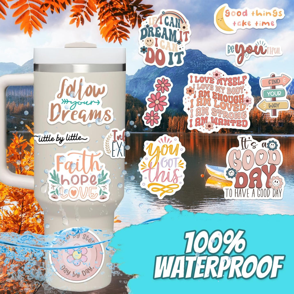 Motivational vinyl stickers on a tumbler and in a scenic background. Stickers feature inspirational quotes and boho designs.