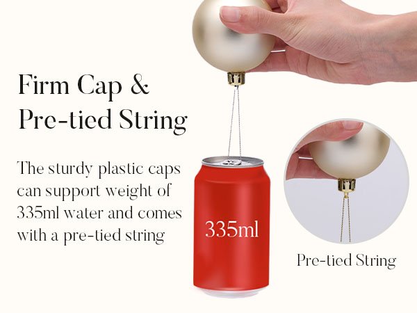 Christmas ornaments demonstrating firm cap and pre-tied string strength by holding up a 335ml can.
