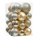 Clear plastic box filled with assorted gold and silver Christmas ball ornaments in various sizes and finishes.