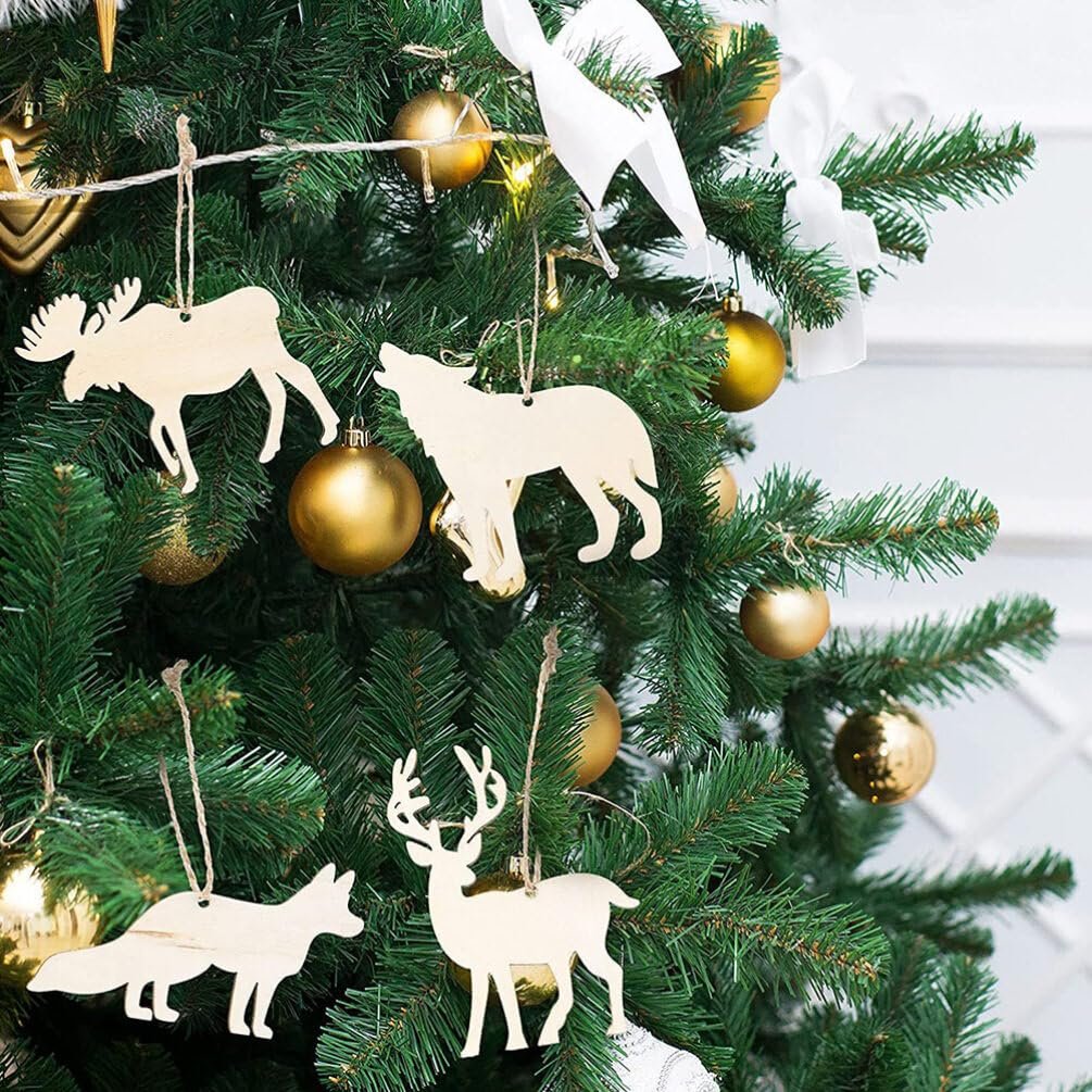 Unfinished wooden forest animal cutouts hanging on a Christmas tree with gold ornaments