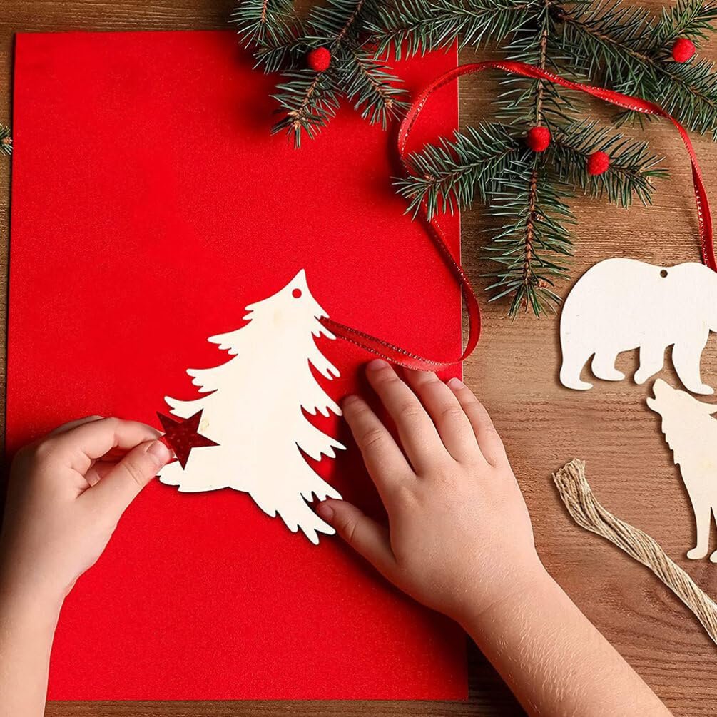 Child's hands decorating unfinished wooden forest animal cutouts with holes for crafts
