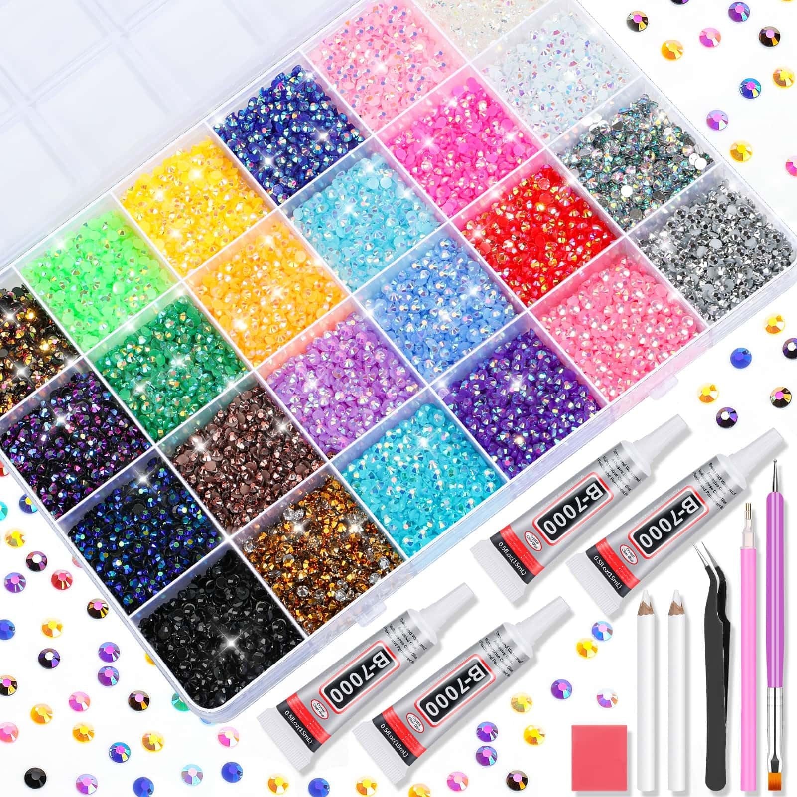Flat lay of a craft kit containing a divided organizer filled with colorful rhinestones and four tubes of B-7000 adhesive glue, tweezers, and applicators.