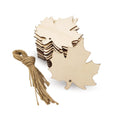 Stack of unfinished wood maple leaf cutouts with a bundle of twine on a white background.