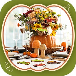Fall truck and pumpkin cutouts arranged on a Thanksgiving table setting with a floral centerpiece.