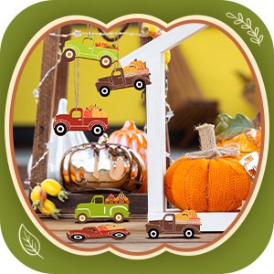 Unfinished wooden fall truck and pumpkin cutouts arranged with pumpkins and fall decor.